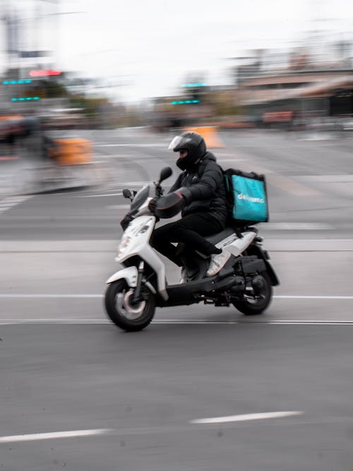 Man in Black Jacket Riding Motorcycle on Road