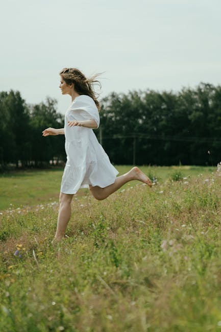 How Does Connecting With Nature Improve Mental Wellness? 15 A Person Walking Through A Park On A Sunny Day