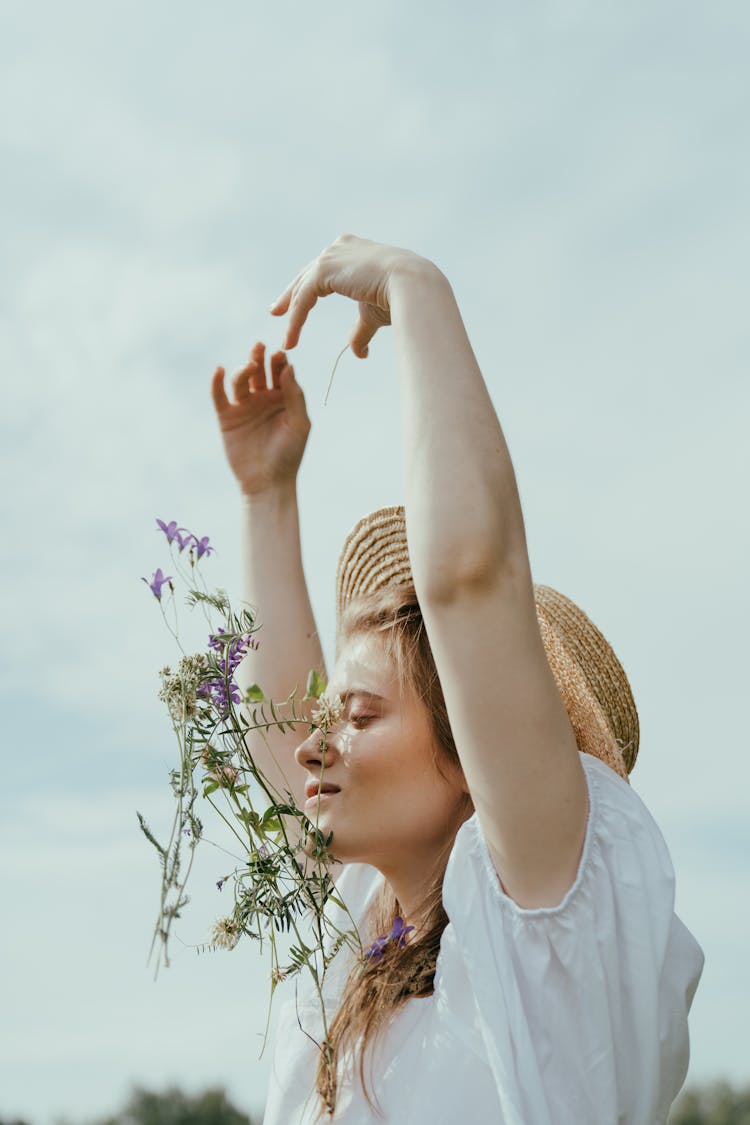 Woman Tossing Bunch Of Flowers