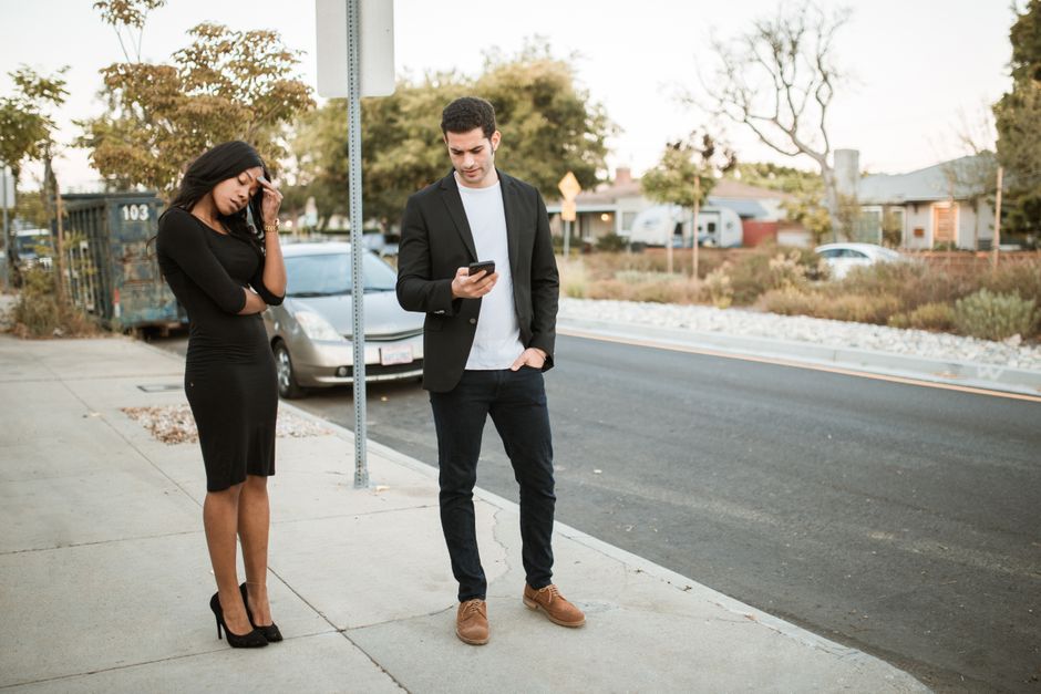 two people arguing on sidewalk