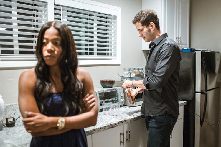 Couple Cooking In A Kitchen