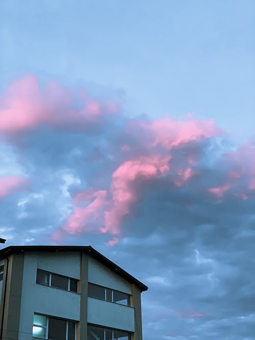 Pink and blue sky above building