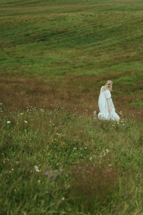 Woman in White Dress on Meadow
