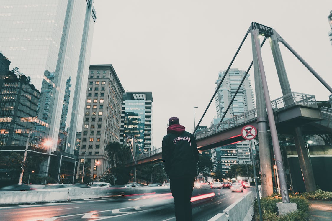 Free Man in Black Hoodie Looking at the Highway Stock Photo