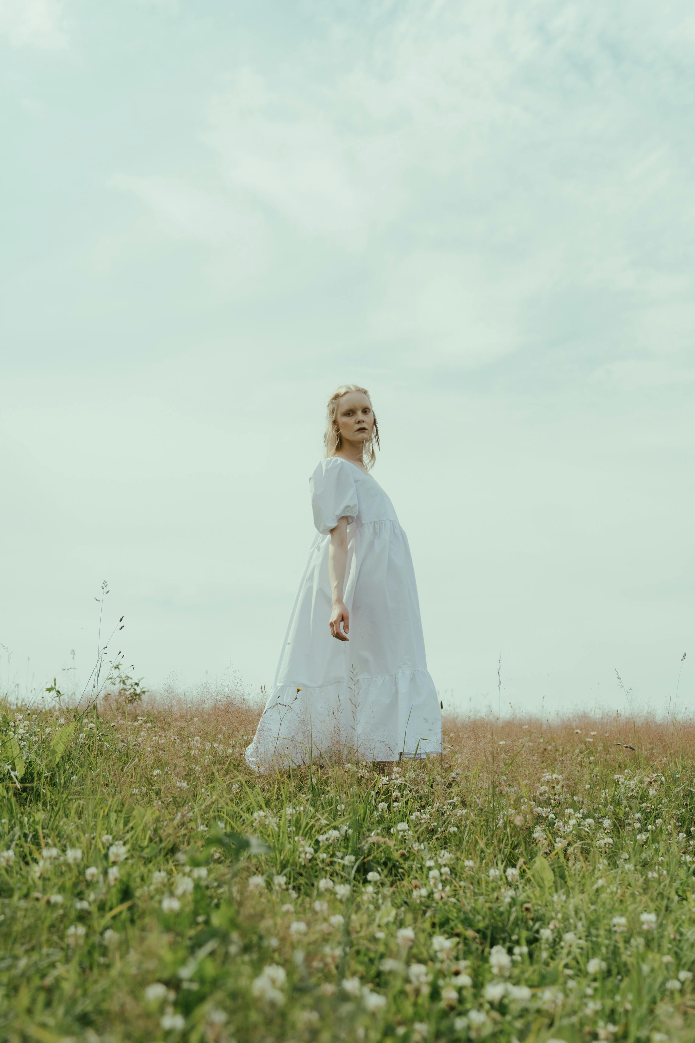 A Woman Running Barefoot on a Field · Free Stock Photo