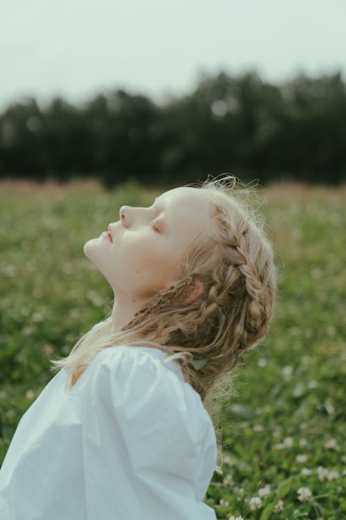 Side View of Blonde Hair Woman With Eyes Closed 