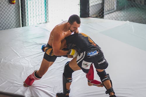 Men Fighting on Boxing Ring