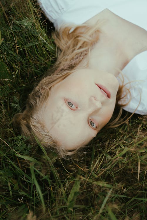 A Woman Lying Down on the Grass