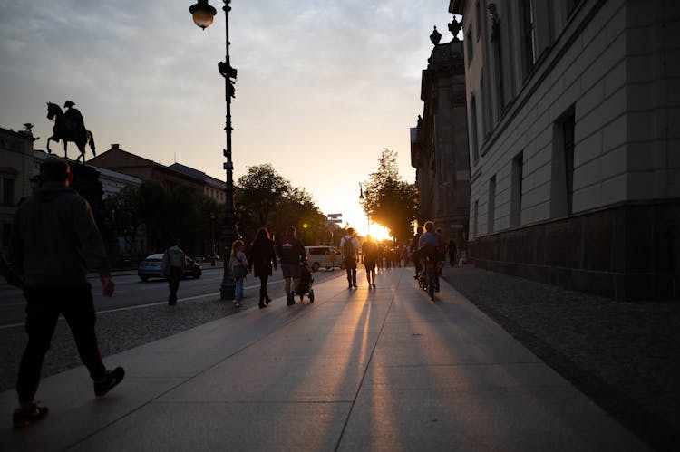 People Walking City Street On Sunset