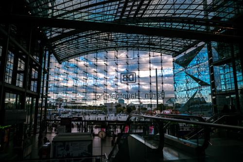 Free Modern architectural design of Berlin Hauptbahnhof station with glass walls and skyline view. Stock Photo