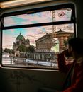 Woman in Red Jacket Looking at the Window