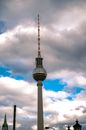 White and Black Tower Under Blue and White Cloudy Sky