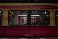 People in Red Train