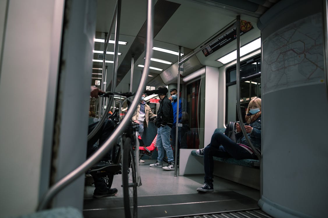 People Sitting Inside A Train