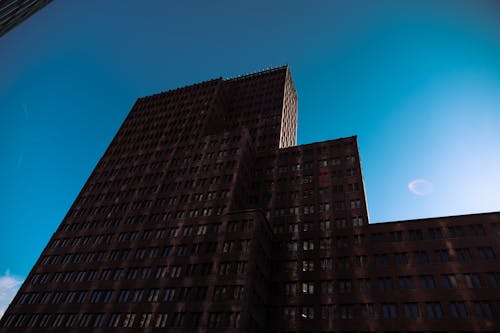 Brown Concrete Building Under Blue Sky