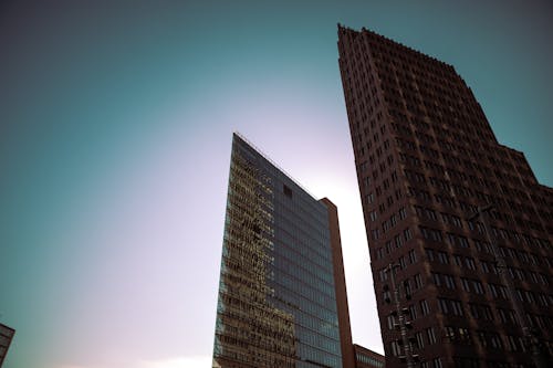 Brown Concrete Buildings Under Blue Sky