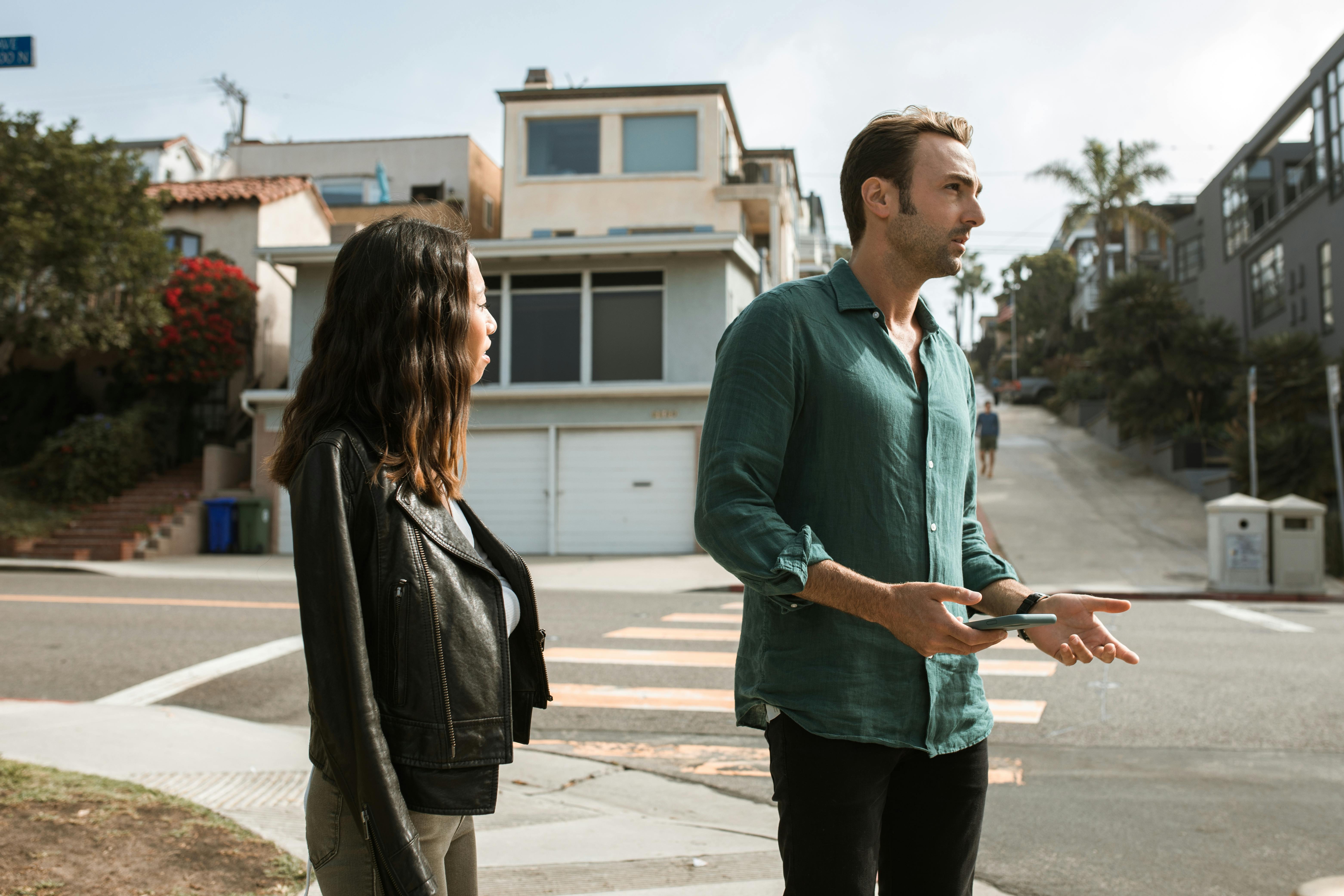 man and woman standing on the street
