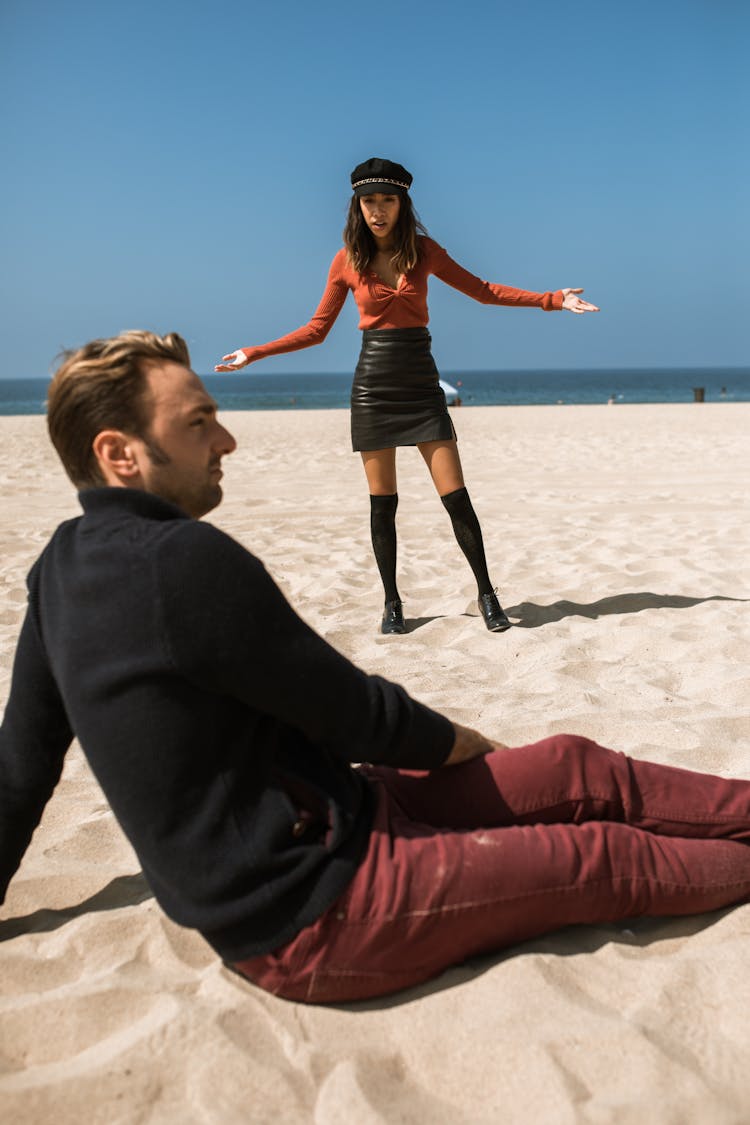 Woman Feeling Upset With Man While Talking On The Beach