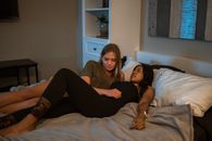 Two Women Lying In Bed