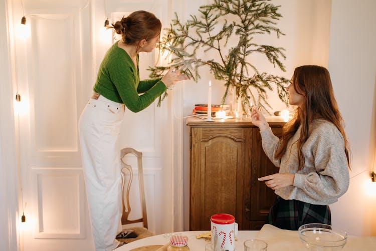 Women Setting Up Decorations