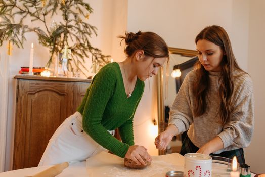 Woman in Green Long Sleeves Kneading the Dough 