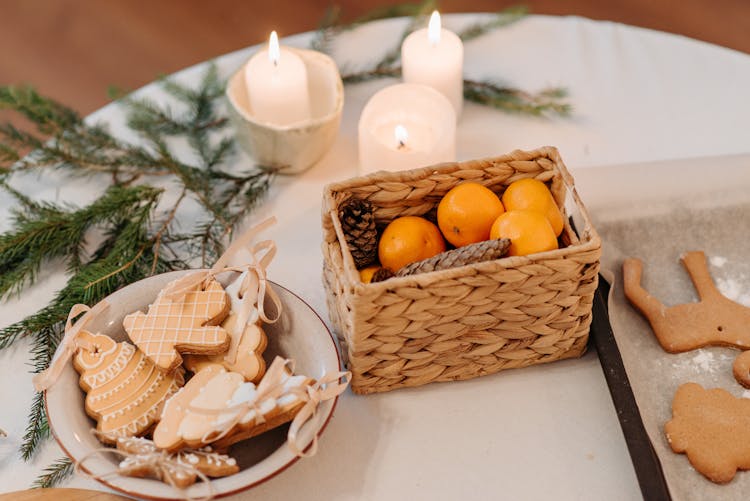 Basket Of Fruits Near Candles