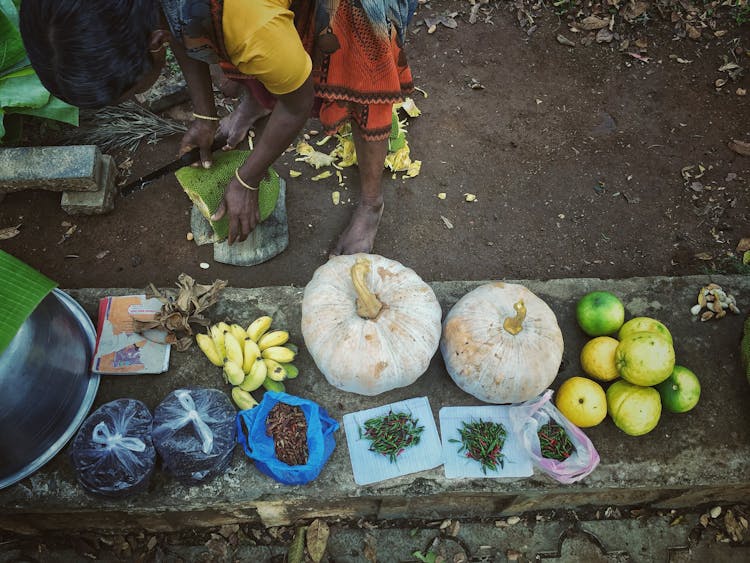 Woman With Stacked Fruit And Vegetables