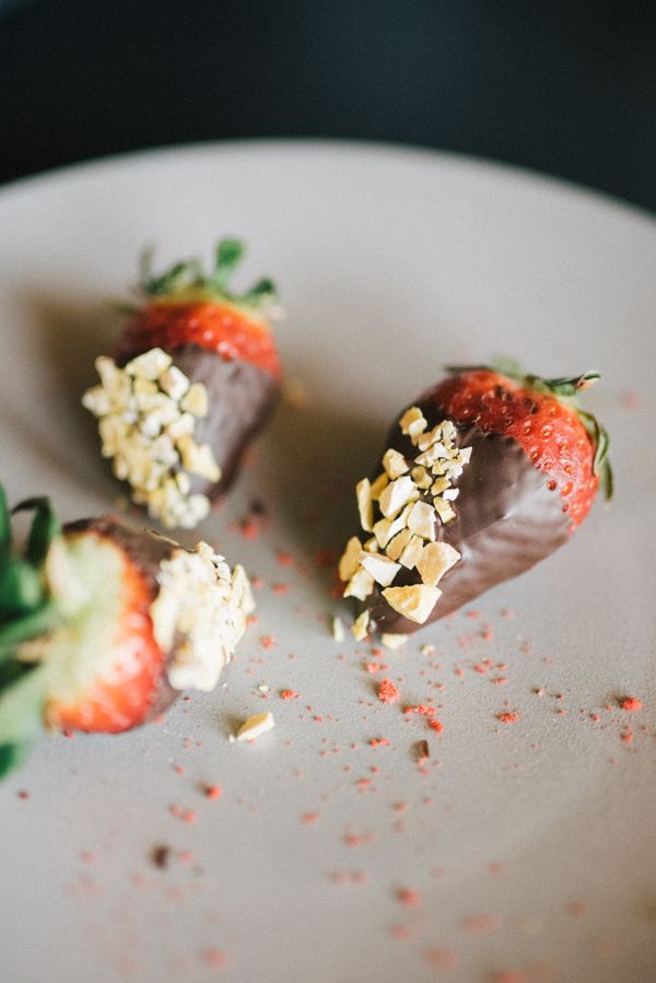 Chocolate-dipped strawberries with chopped nuts on a ceramic plate — photo by Leeloo The First on Pexels