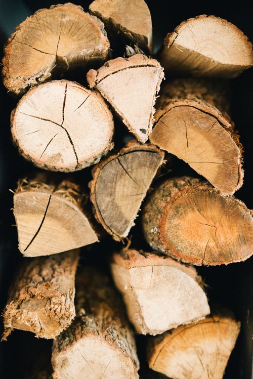 Free Detailed view of stacked wooden logs, showcasing natural textures and patterns. Stock Photo