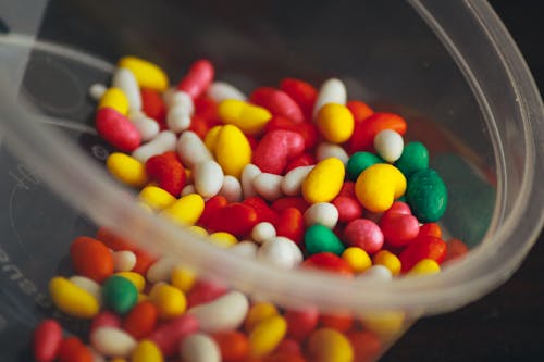 Free Colorful Candies on a Plastic Container Stock Photo