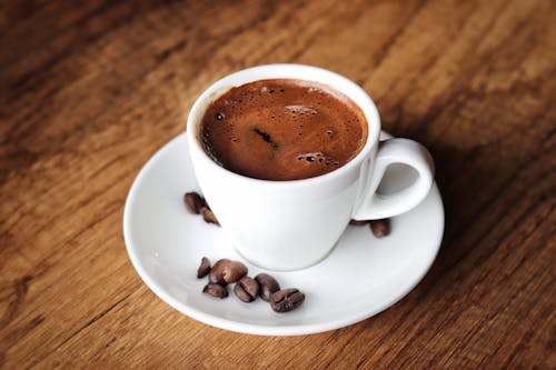 Free Delicious Cup Of Coffee On White Saucer Stock Photo