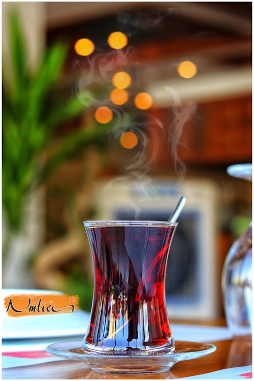 Free Close-up of a Steaming Tea on a Restaurant Table  Stock Photo