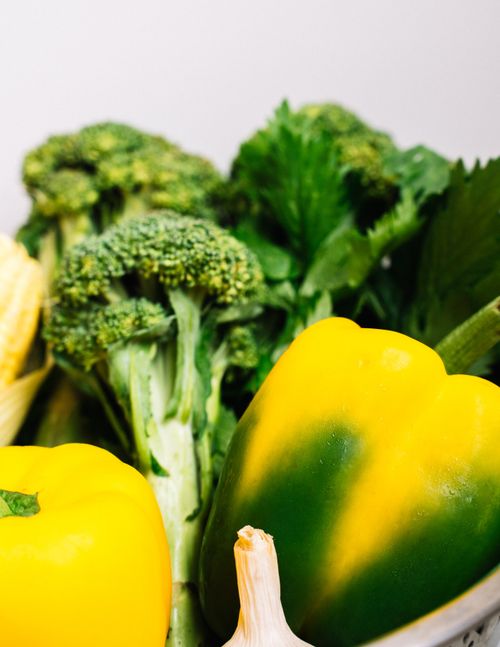 Free A vibrant collection of fresh organic vegetables including broccoli, bell peppers, celery, and garlic. Stock Photo