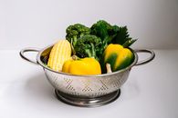 Yellow and Green Bell Pepper on Stainless Steel Bowl