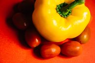 Yellow Bell Pepper Beside Red Round Fruits