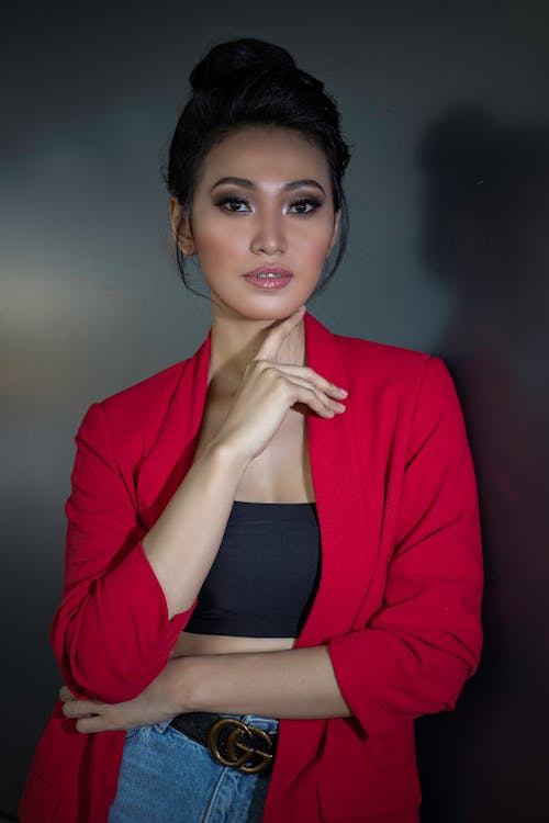 A Woman in a Red Blazer Posing