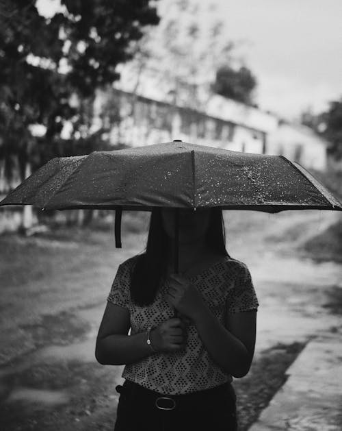 Grayscale Photo of Woman Holding an Umbrella