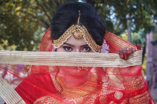 A Woman Covering Her Face with Sari