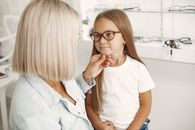 Small Girl Getting Glasses at Optician 