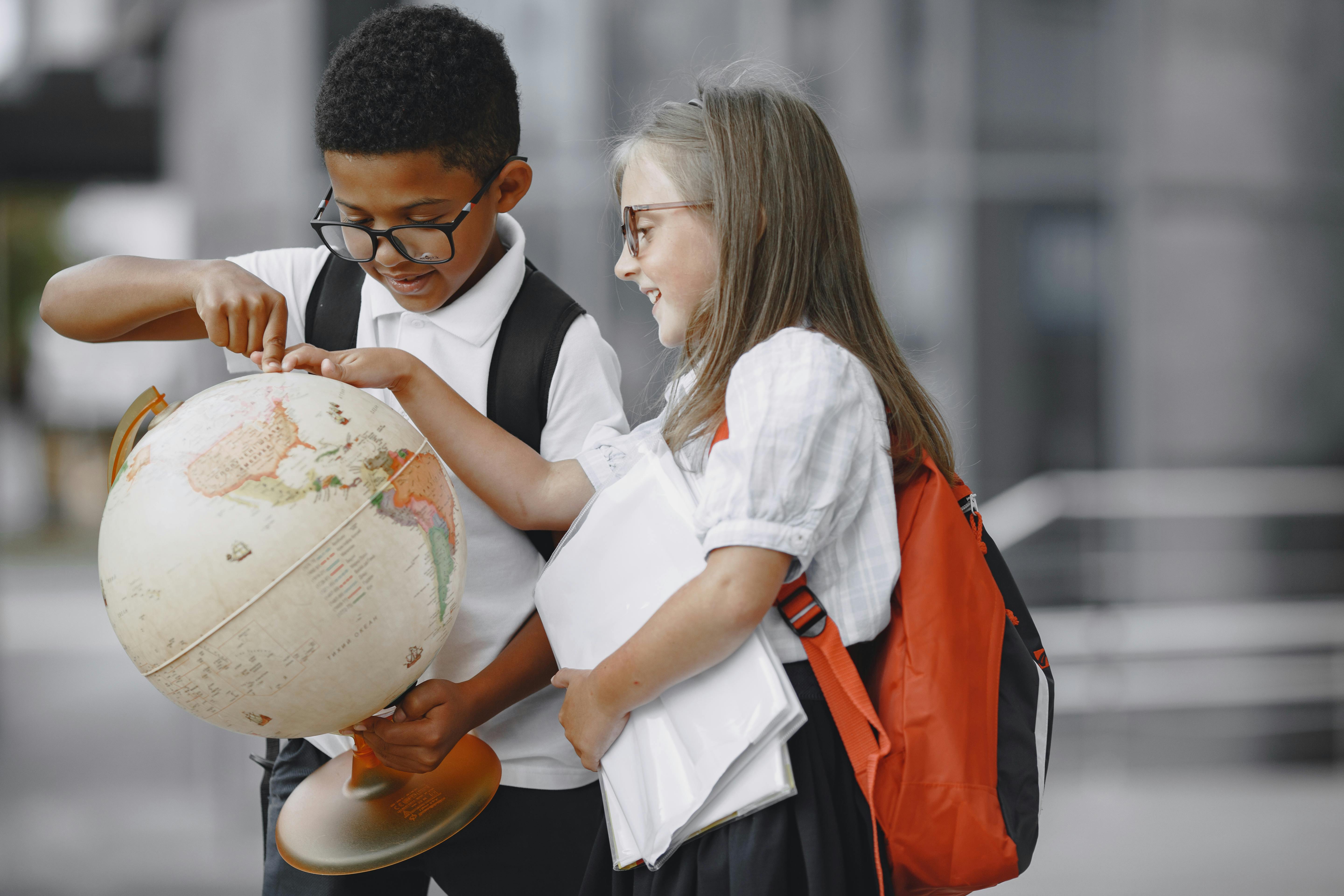 students looking at the world globe