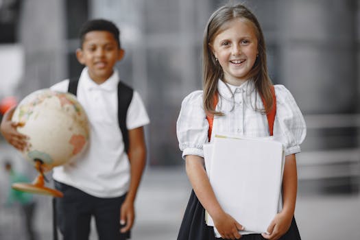 Happy students in school uniforms with books and globe, ready for learning adventures.