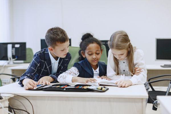 Children studying together at Catholic school