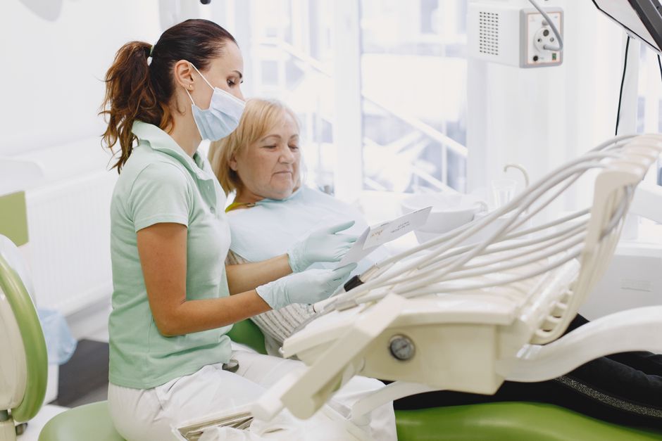 dentist interacting with patient dentist interacting with patient
