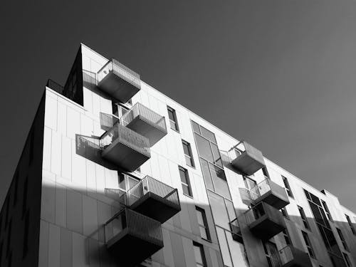 Free Grayscale Photography of Building With Glass Window Stock Photo