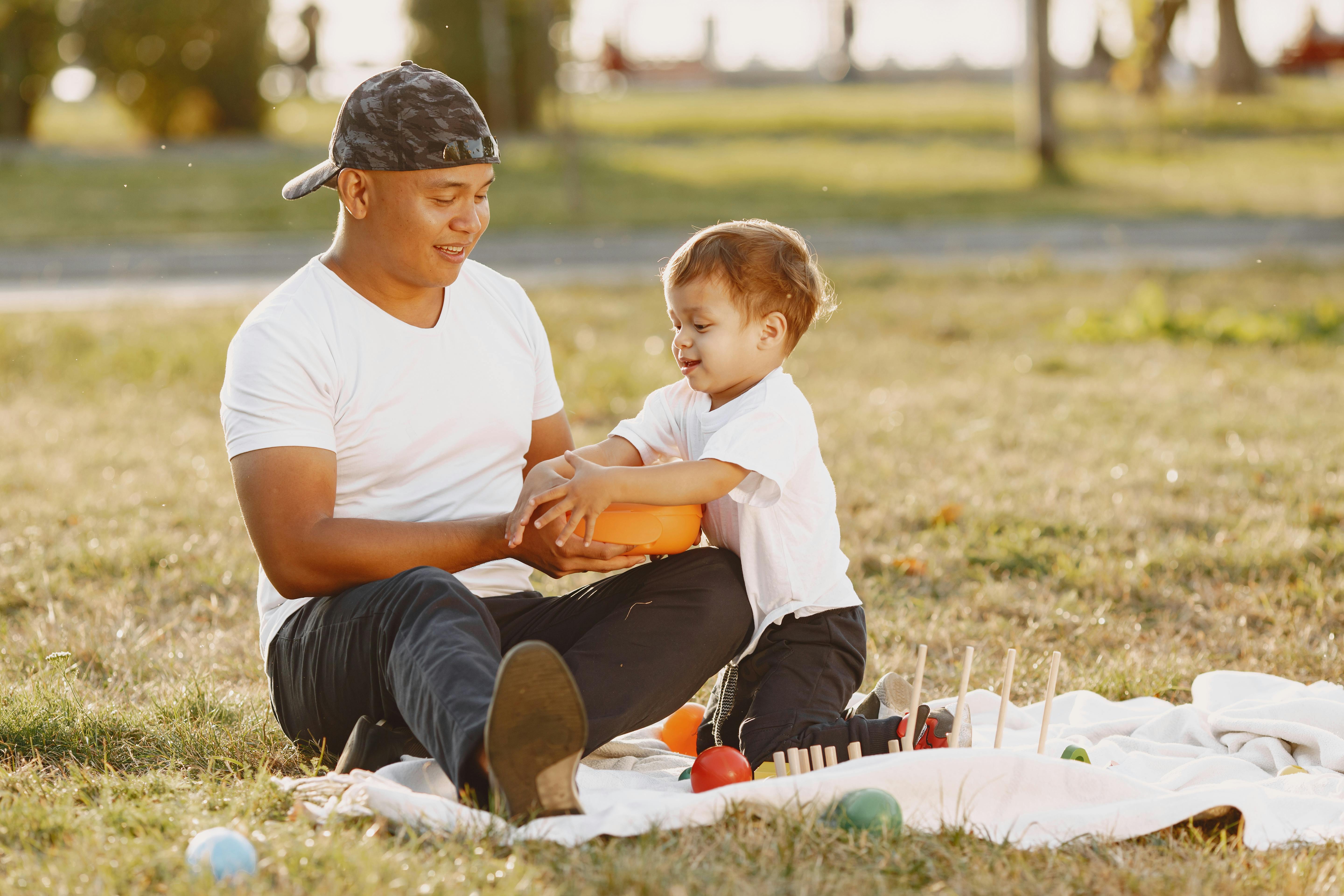 father with son playing with toys