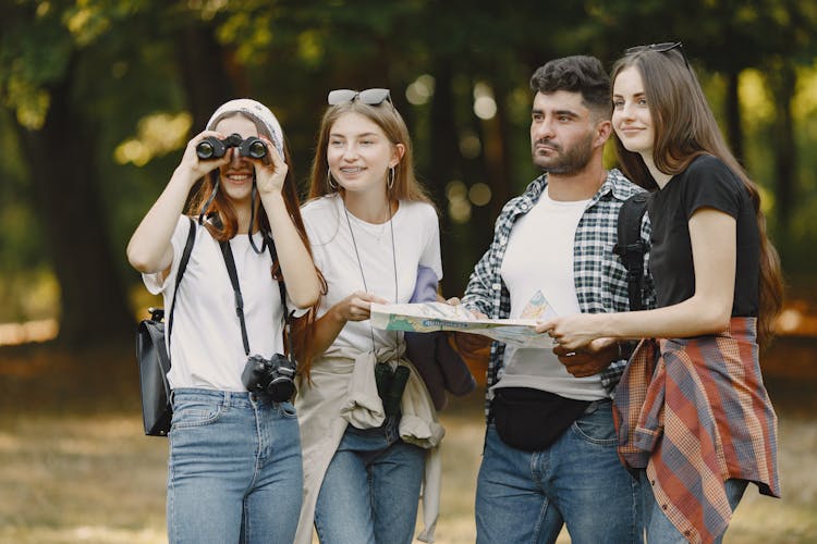 Friends With Map In Forest Together