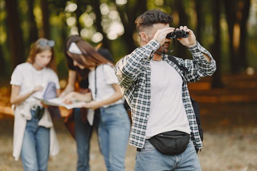 Man Looking through Binoculars