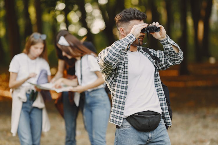 Man Looking Through Binoculars