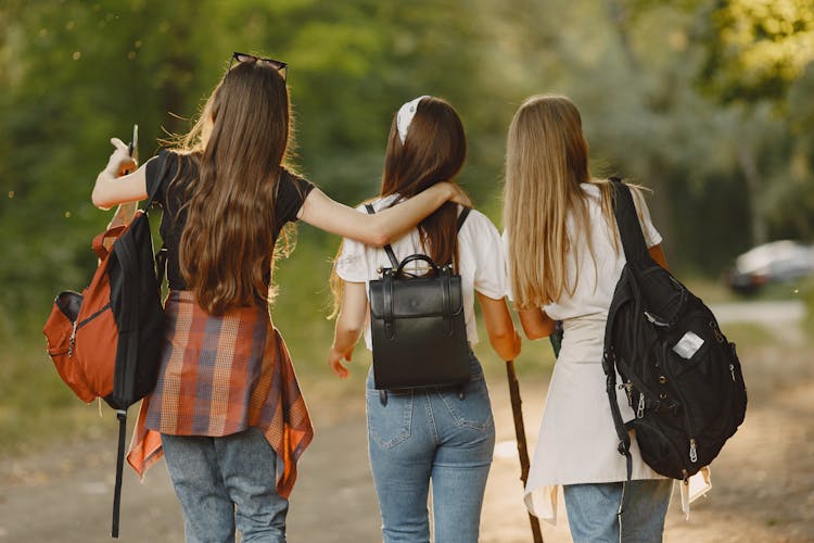 Girlfriends Walking In Forest In Summer