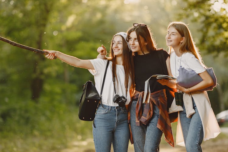 Happy Girlfriends Making Selfie In Forest